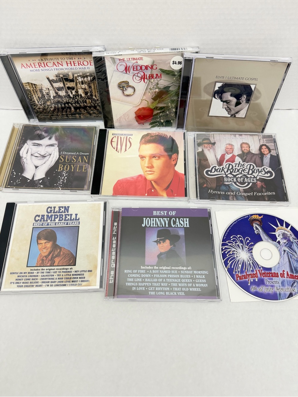 Group of 8 CDs. Untested. Includes Elvis, Glen Campbell, Johnny Cash and more.